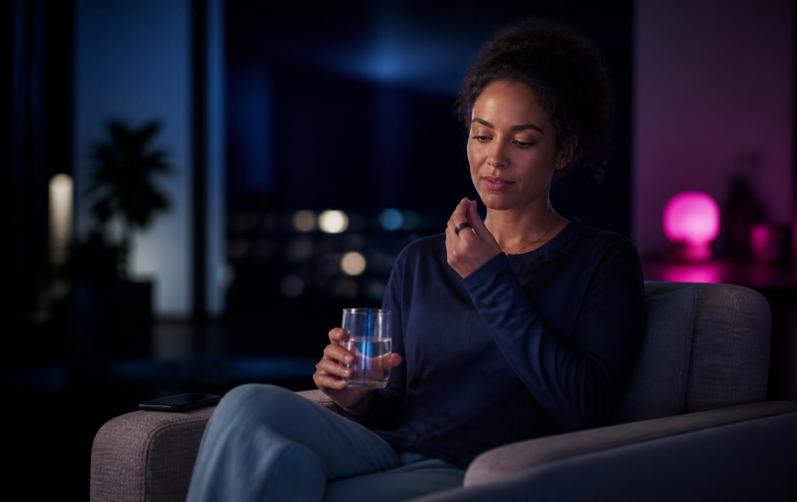 A person considering medication with her health context close at hand